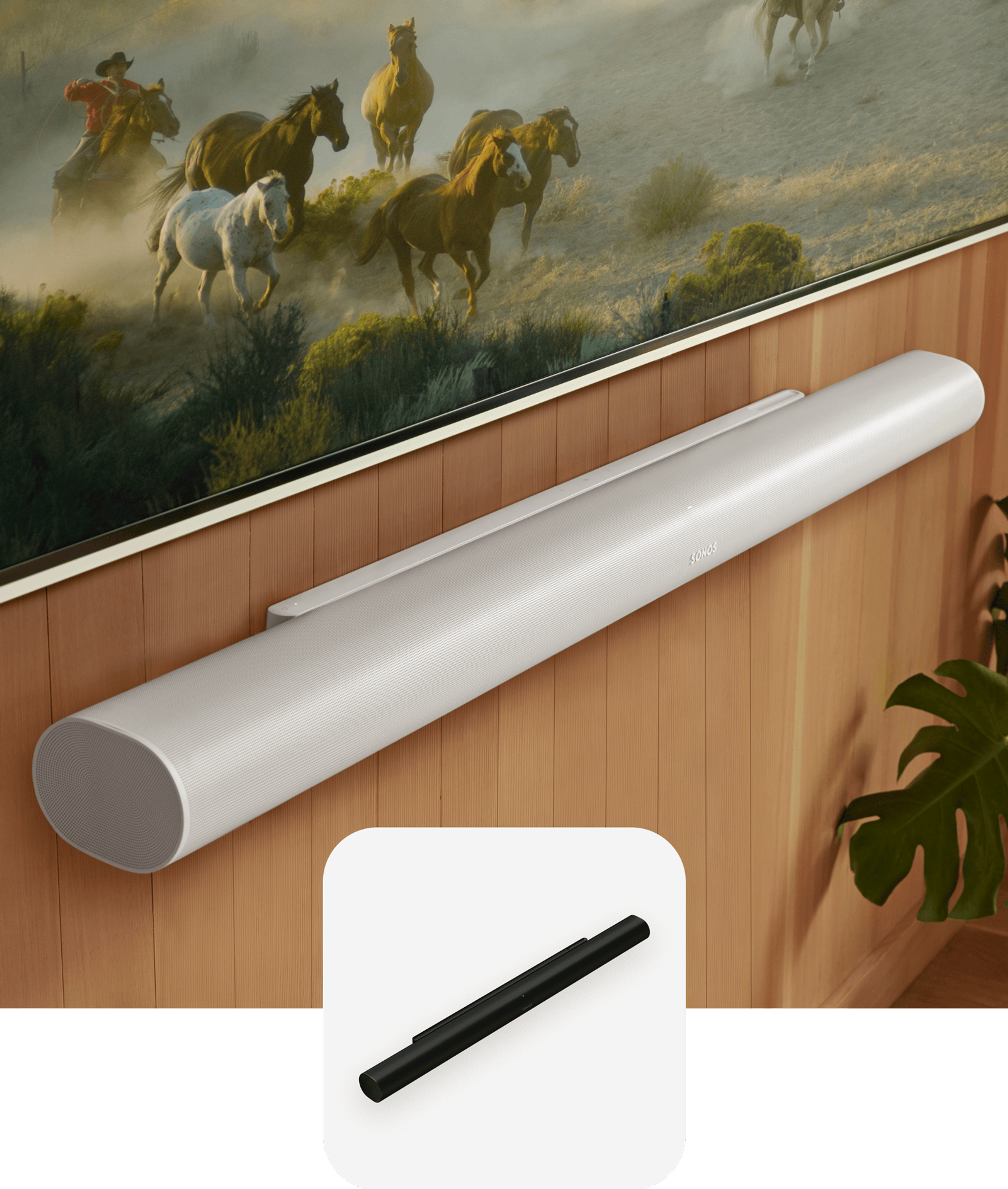 Closeup of a white Arc Ultra mounted to a wood-paneled wall below a TV and a black Arc Ultra product tile overlay