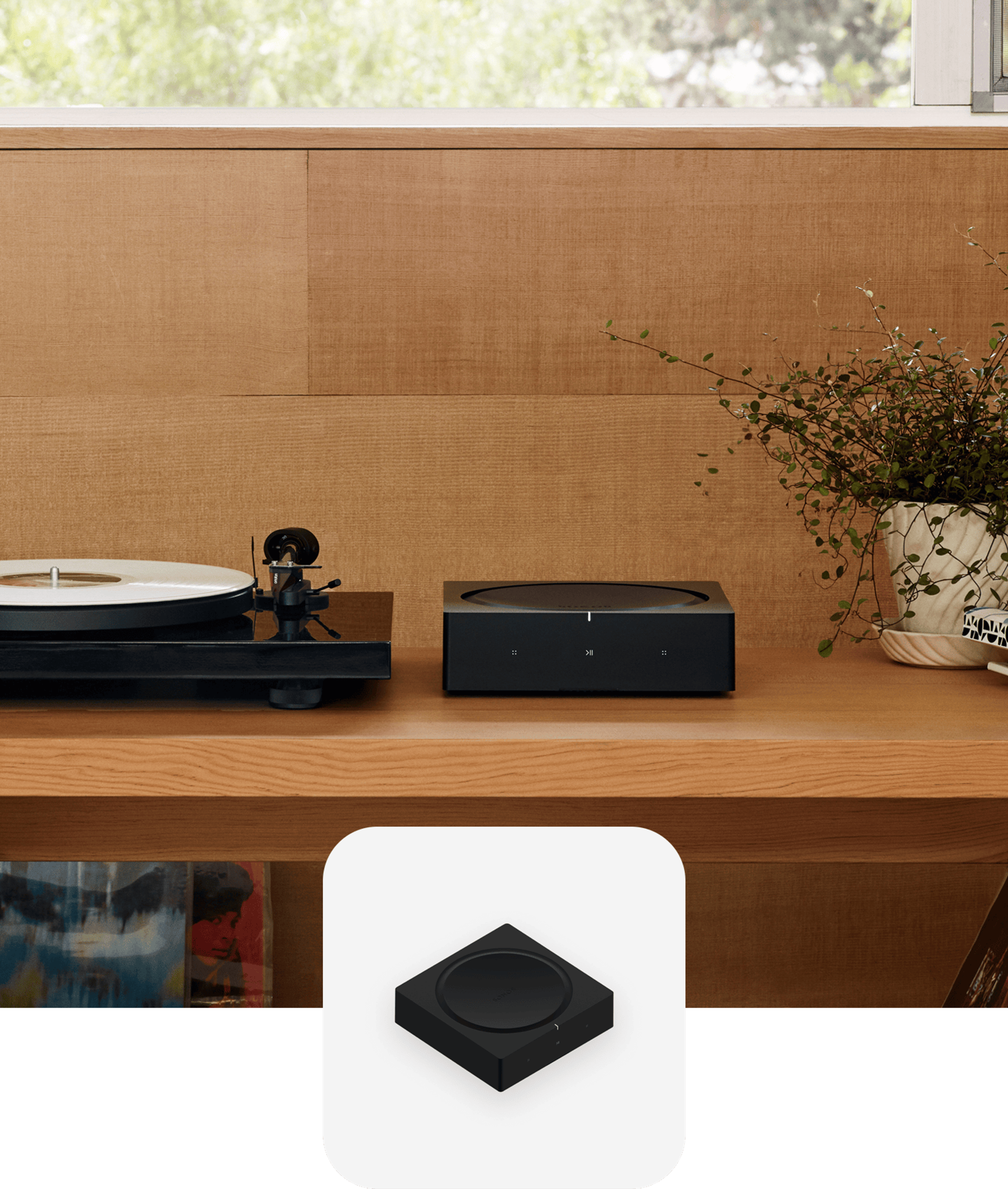 Sonos Amp sitting on a shelf next to a record player