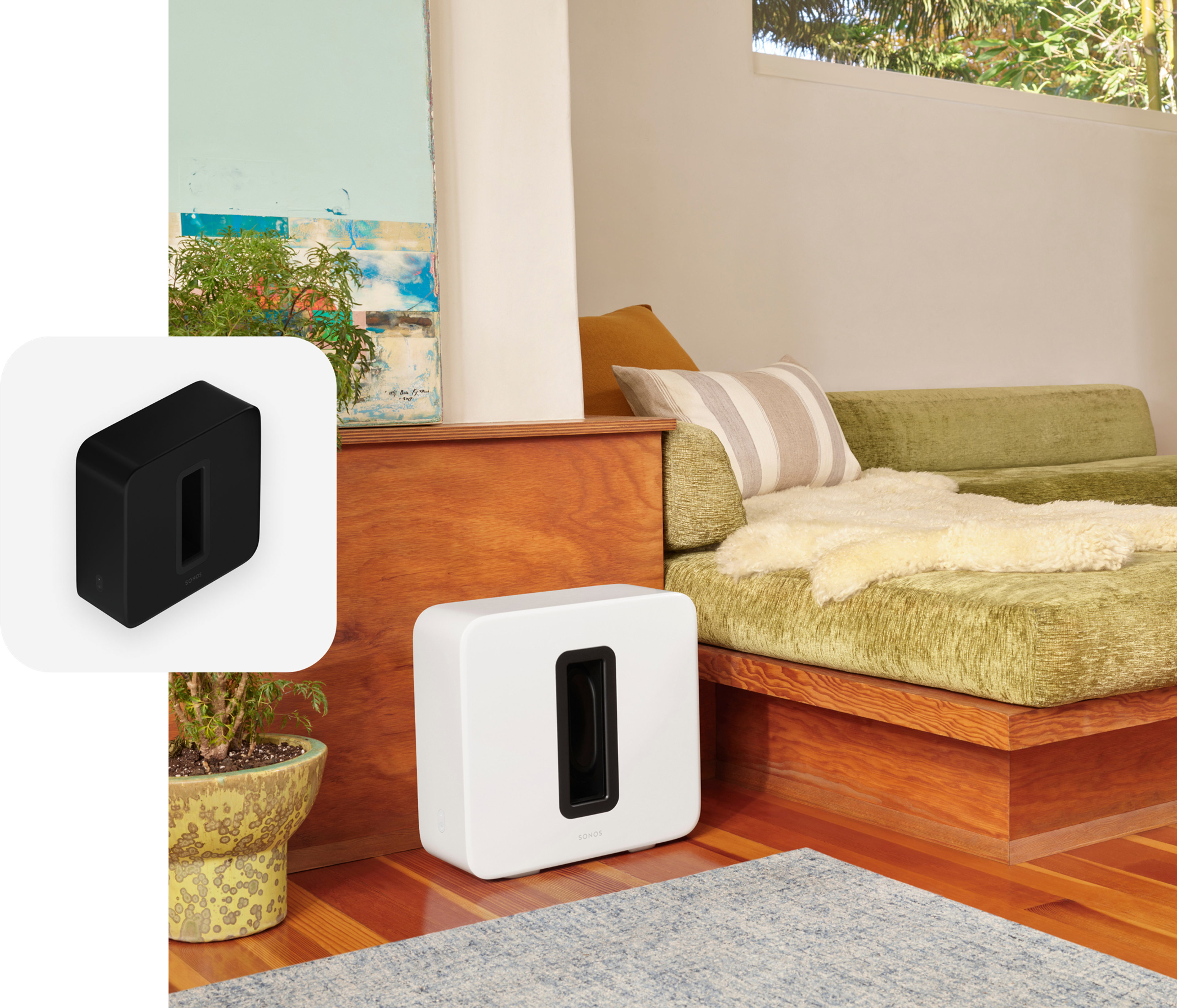 A white Sub (Gen 3) sitting next to a couch with green cushions