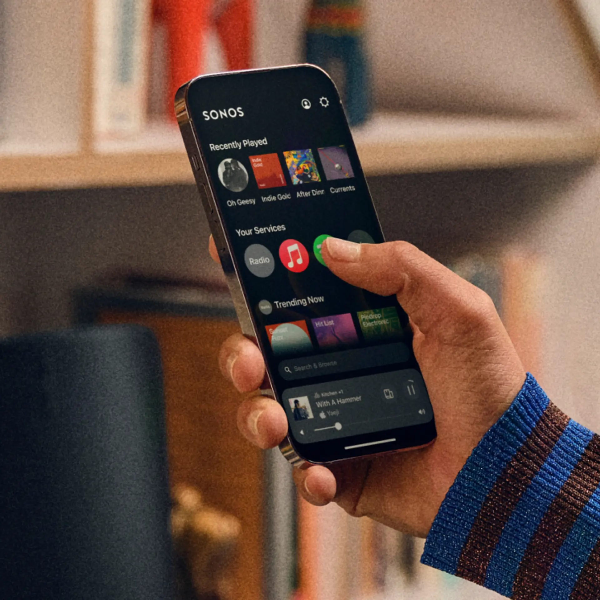 An iPhone with the Sonos app open, showing the Home screen