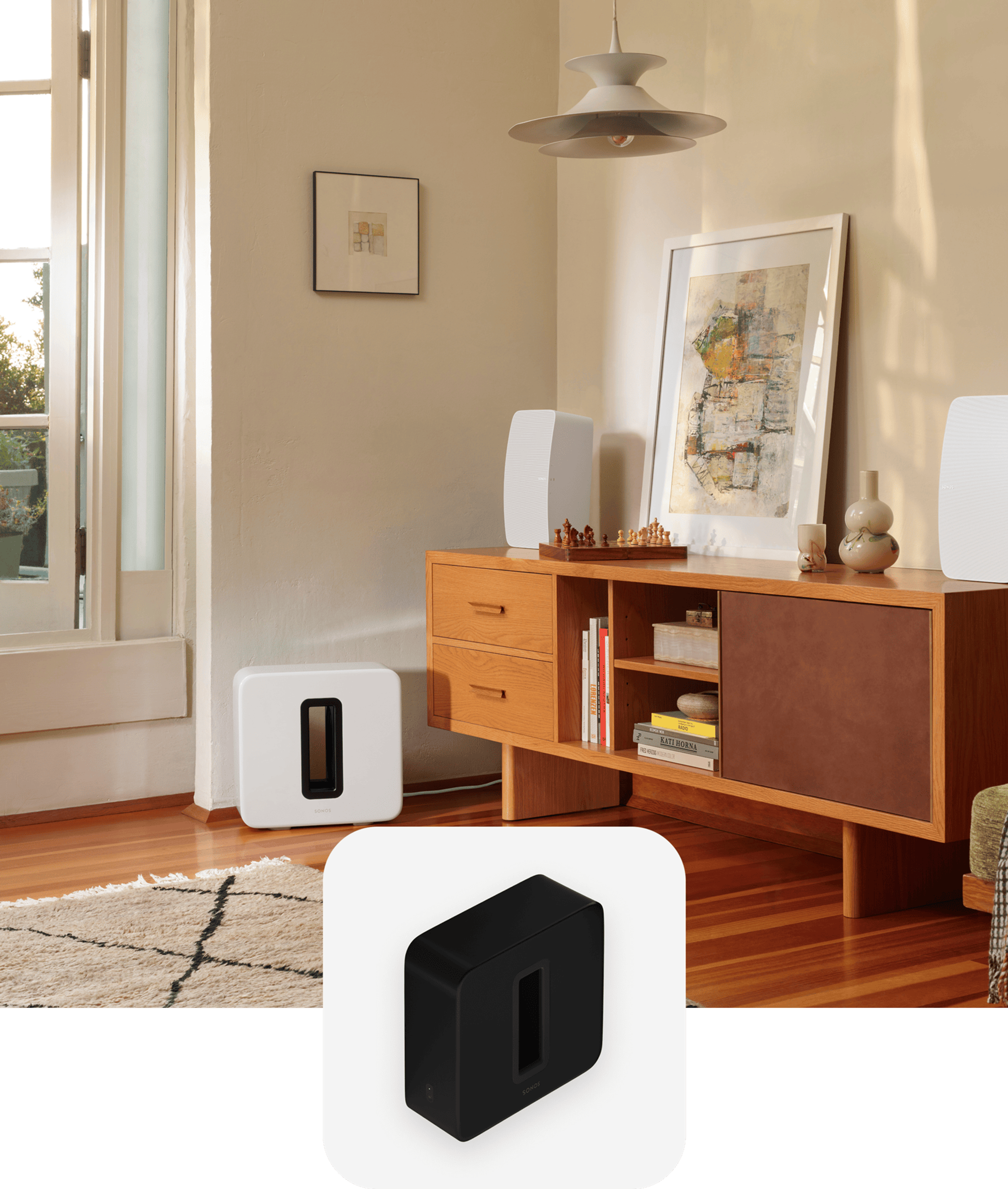 A white Sub (Gen 3) next to a credenza with a pair of white Sonos Fives