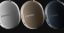 Side detail view of white, Sand, and Agave-coloured Sonos Ace Ultra headphones on a dark-grey background