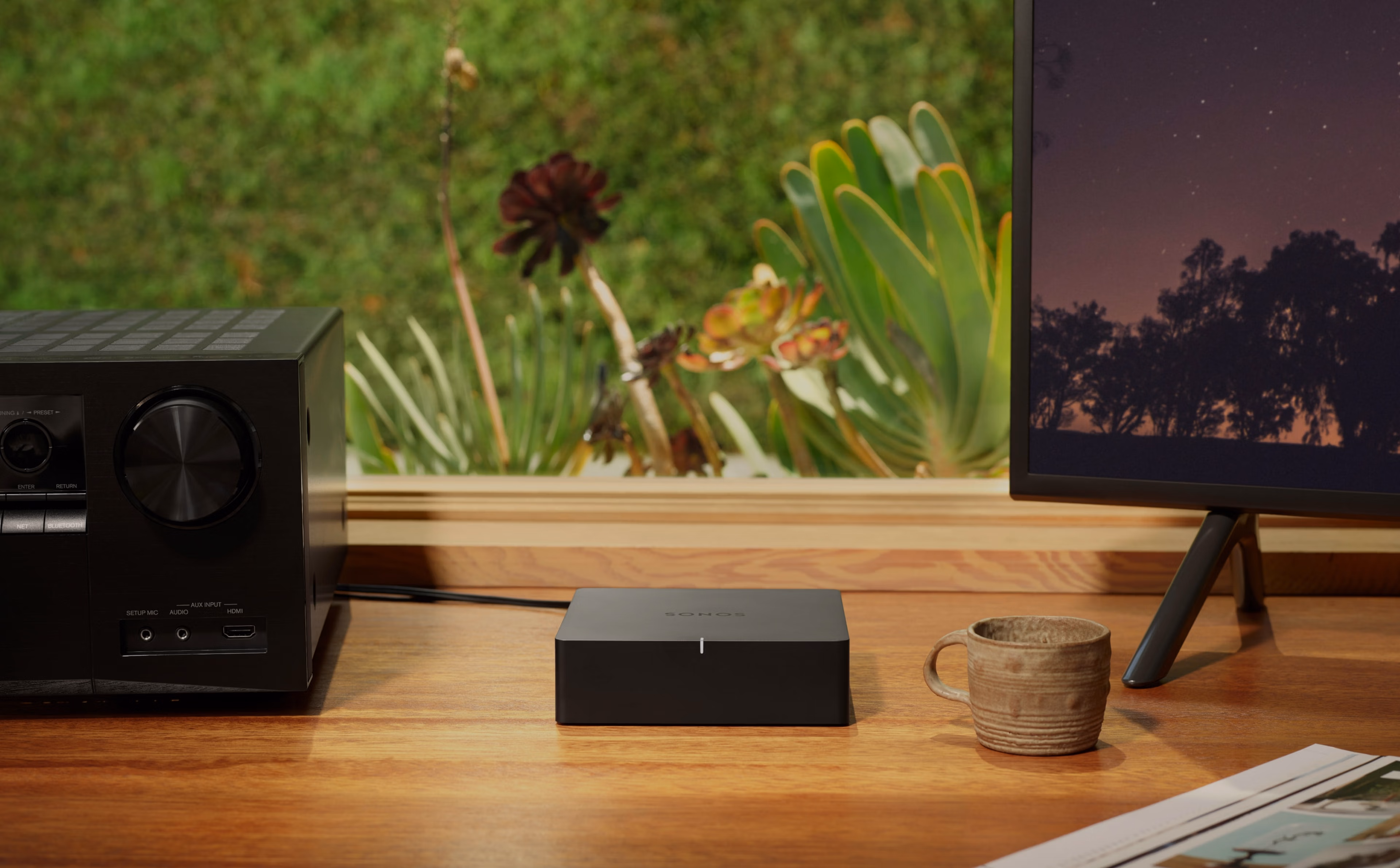 Sonos Port on desk next to stereo receiver