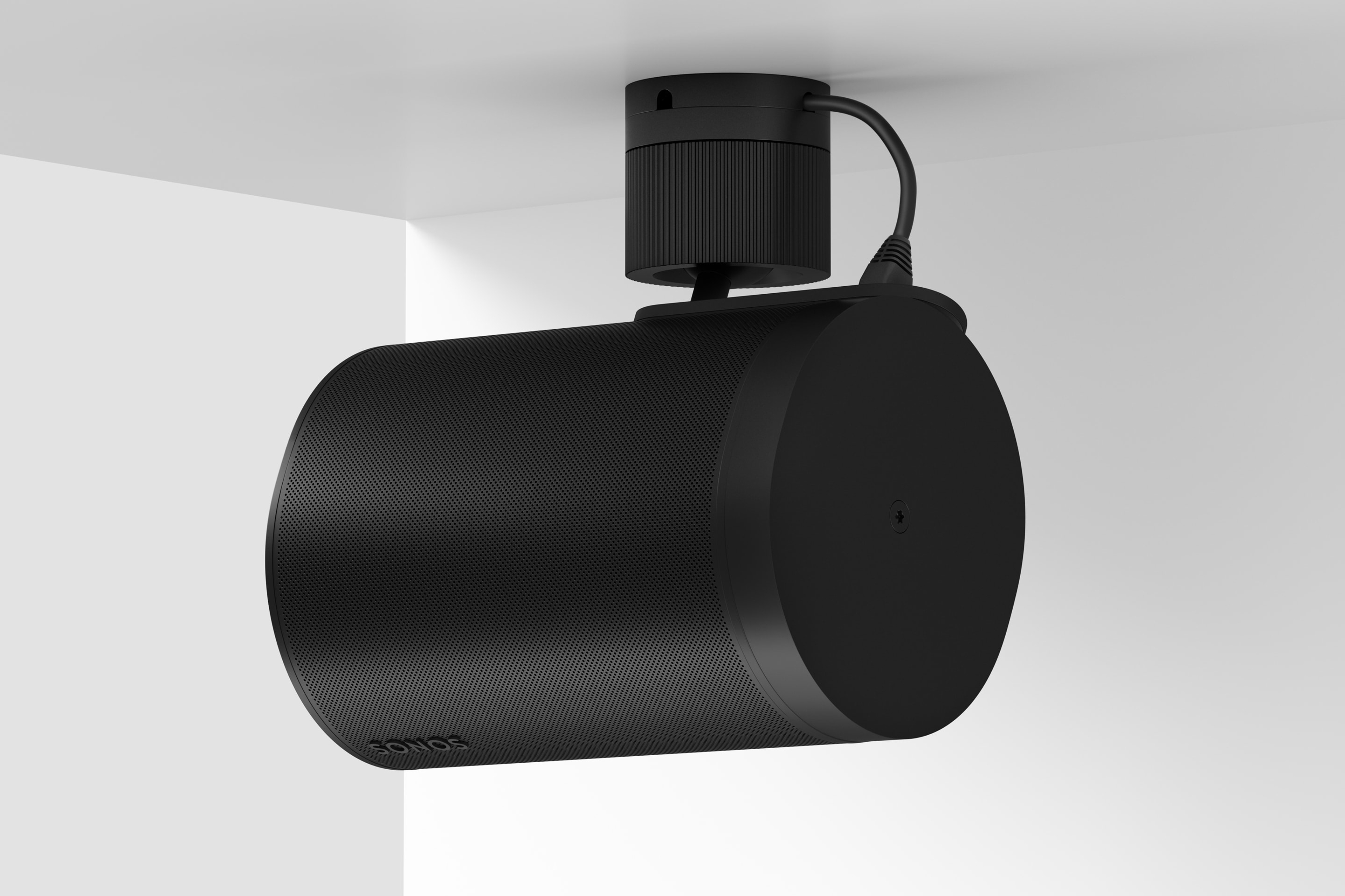 A black Sonos Era 100 Pro mounted on the ceiling horizontally