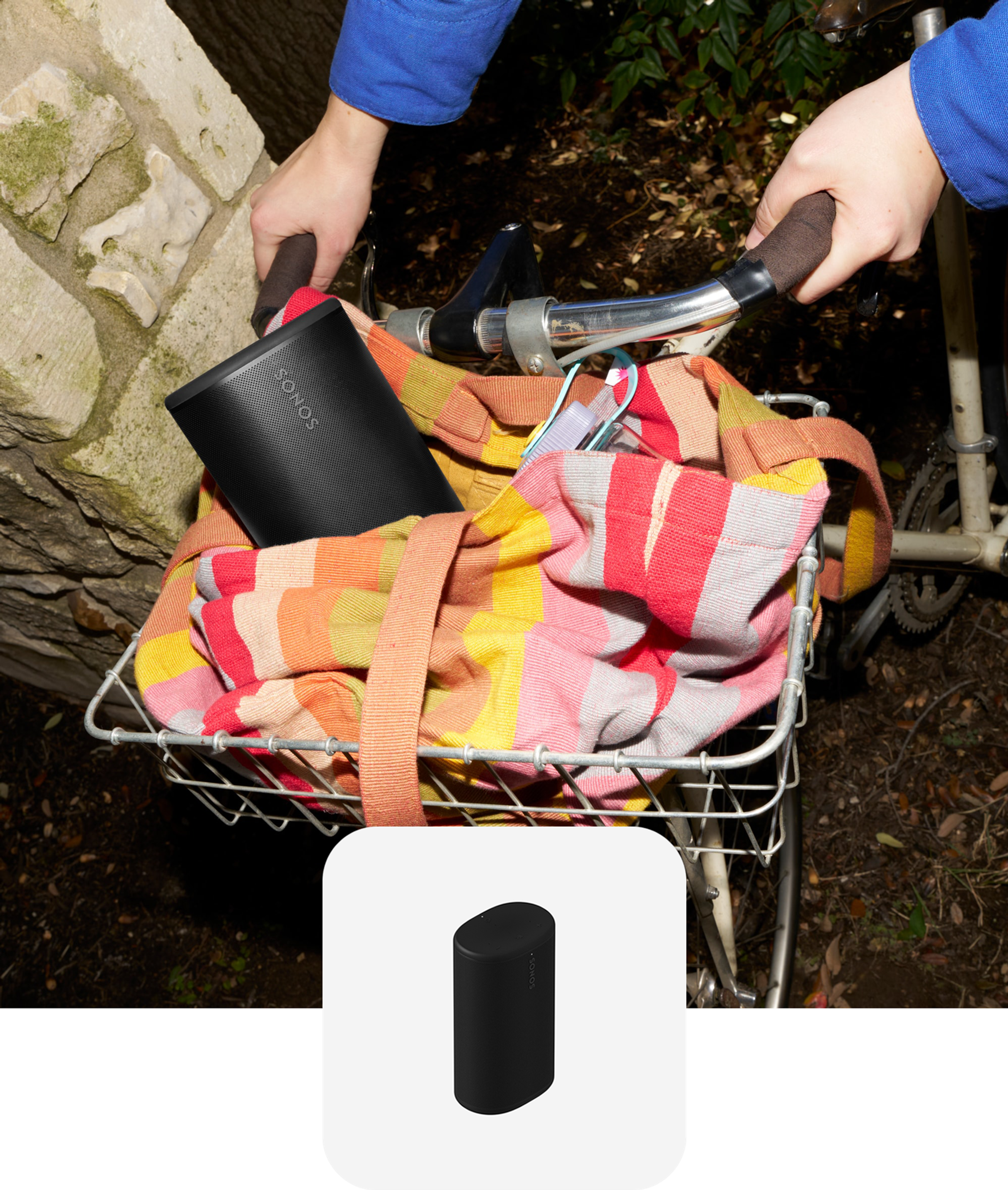 Black Sonos Play speaker placed inside a tote bag in a bicycle basket