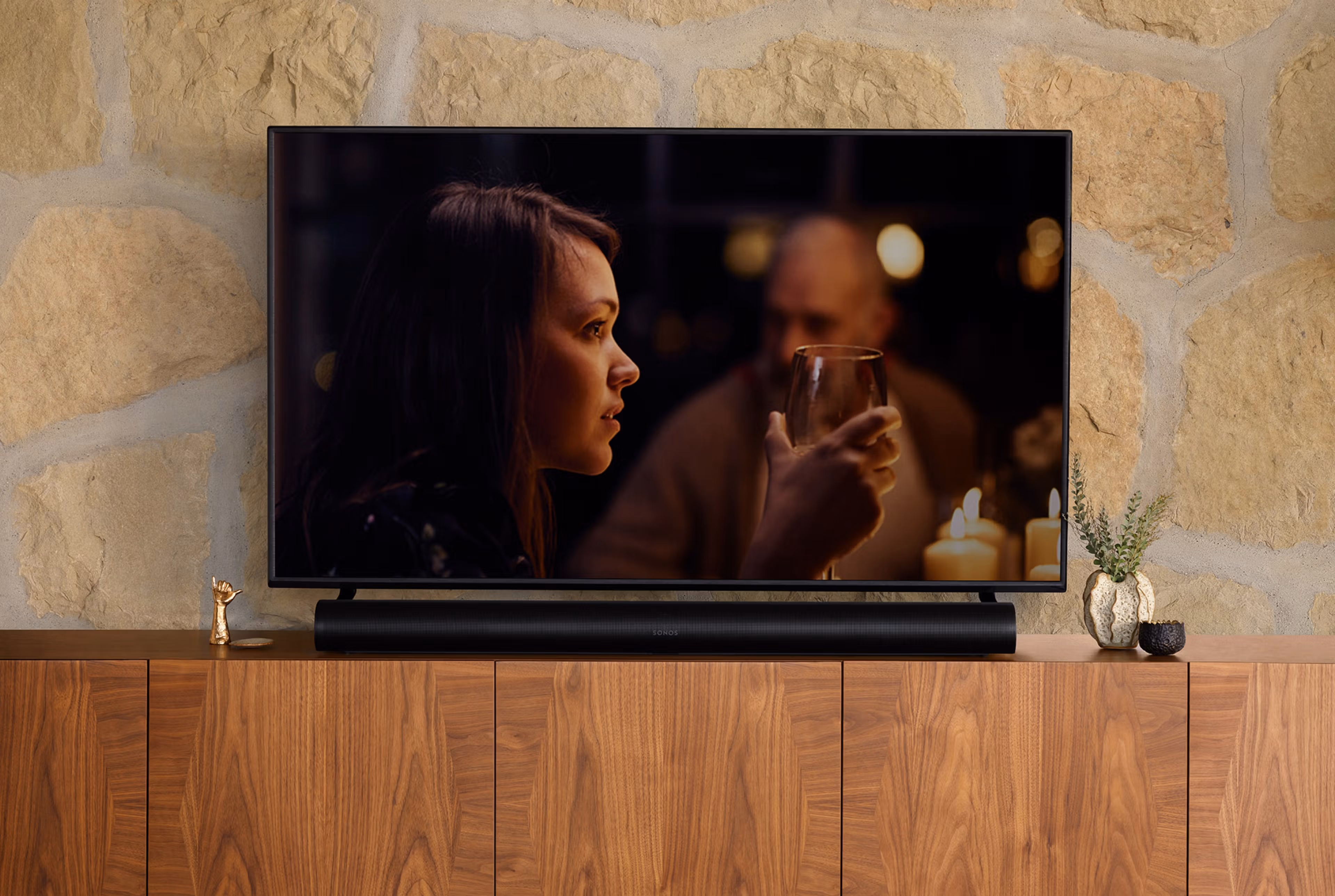 Sonos Arc black and TV above a cabinet